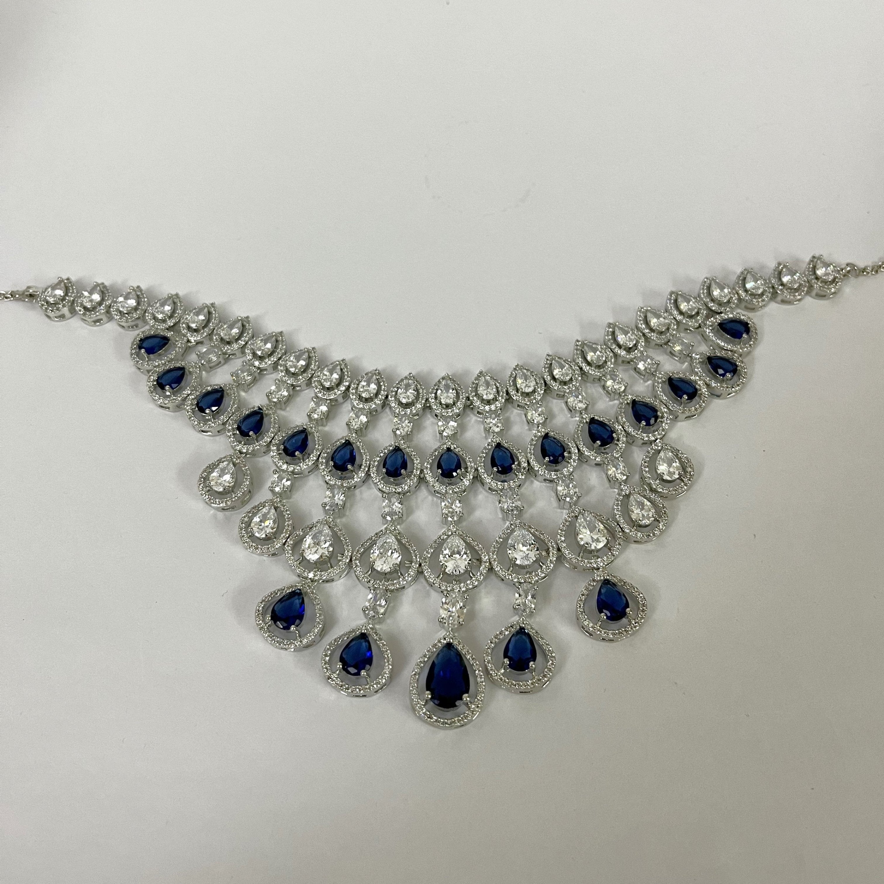 Petal Design Blue & White Crystal AD Studded Necklace Set with Maang Tikka